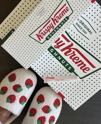 rhode strawberry glaze lip treatment and krispy kreme donut
